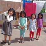 Four young House Daughters standing together outdoors