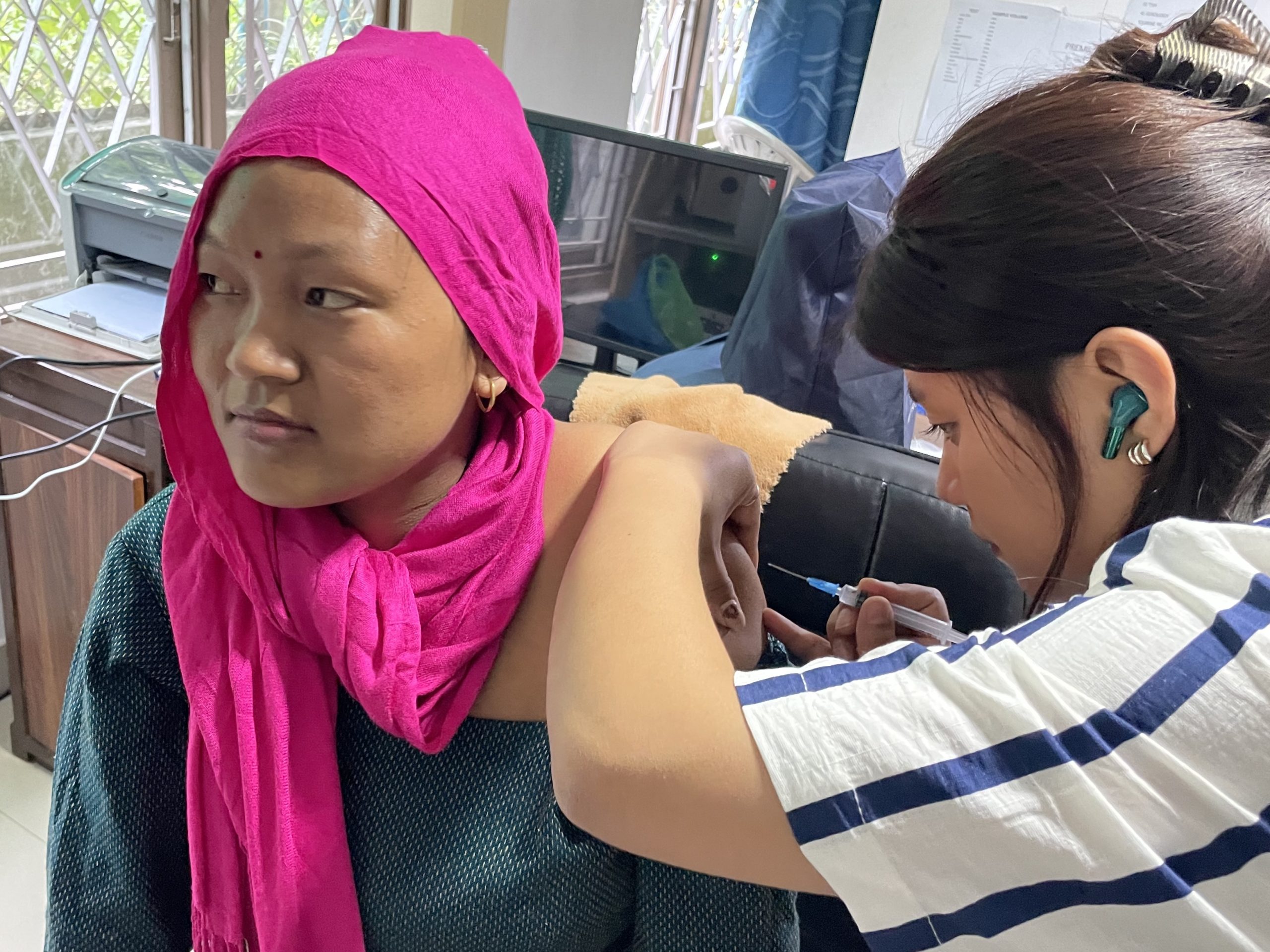 A local factory worker receives a no-cost HPV vaccination during a House with Heart outreach initiative