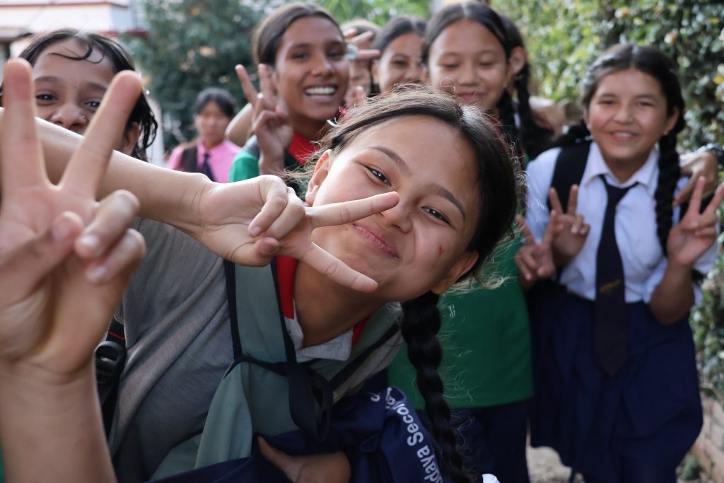 IMG_7858 Students in House with Heart’s Rise Above program smiling and posing together outdoors