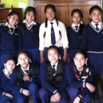 Rise Above students posing together in school uniforms